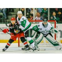 Texas Stars goaltender Landon Bow and defenseman Dillon Heatherington try to keep the Grand Rapids Griffins at bay