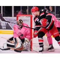 Grand Rapids Griffins right wing Colin Campbell tries to squeeze the puck past San Antonio Rampage goaltender Jared Coreau