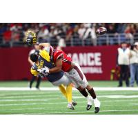 San Diego Fleet QB Mike Bercovici loses his helmet as he is sacked by Shaan Washington of the San Antonio Commanders