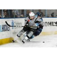 Mitch Reinke of the San Antonio Rampage fights off a check from Milwaukee Admiral Justin Kirkland