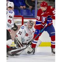 Vancouver Giants goaltender Trent Miner smothers a Spokane Chiefs' shot attempt