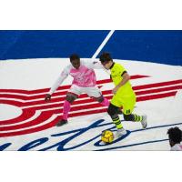 Kansas City Comets defender James Togbah (left) against the Milwaukee Wave