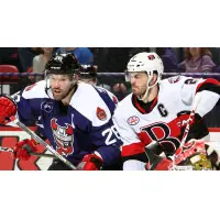 Binghamton Devils left wing Eric Tangradi (left) against the Belleville Senators