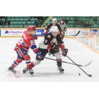 Prince George Cougars left wing Jackson Leppard (right) against the Spokane Chiefs