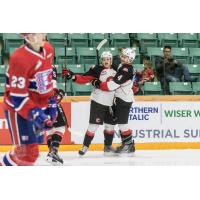 Prince George Cougars celebrate a goal against the Spokane Chiefs