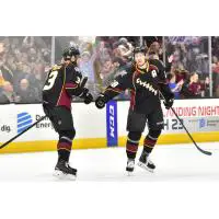 Tommy Cross and Zac Dalpe of the Cleveland Monsters exchange congratulations