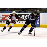 Prince George Cougars left wing Tyson Upper chases the Victoria Royals