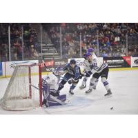 Sioux Falls Stampede right wing Ryan Sullivan (center) against the Tri-City Storm