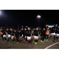 Tacoma Defiance head off the pitch after a season-opening win