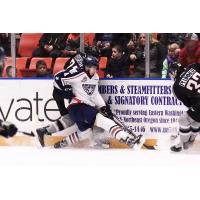 Vancouver Giants right wing Aidan Bargoot up against the boards vs. the Tri-City Americans