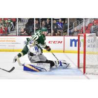 San Antonio Rampae goaltender Ville Husso makes a breakaway save on the Iowa Wild's Gerald Mayhew