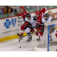 David Makowski (back) and Josh Atkinson of the Allen Americans battle the Wichita Thunder