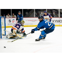 Jacksonville Icemen forward Pascal Aquin (right) reaches for a puck against the Orlando Solar Bears