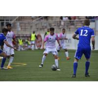 Forward Madison FC defender Ronaldo Lomeli