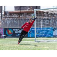 Forward Madison FC goalkeeper Aidan Hogan