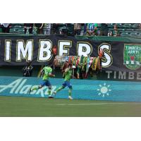 Seattle Sounders FC celebrate a goal against the Portland Timbers