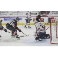 Prince George Cougars right wing Blake Eastman just misses a shot against the Kamloops Blazers