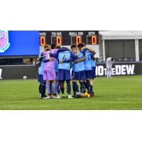 Forward Madison FC huddles up against North Carolina FC