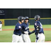 Somerset Patriots exchange high fives after a run