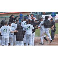 Long Island Ducks mob Lombardozzi after his walk-off grand slam