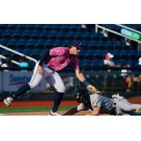 Pensacola Blue Wahoos apply the tag on the Montgomery Biscuits