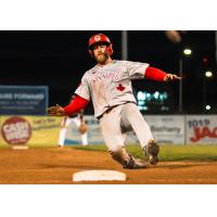 Rob Emery of the Winnipeg Goldeyes slides into third