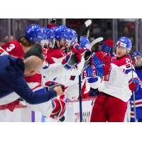 Jakub Stancl of the Kelowna Rockets exchanges high fives along the Czechia bench