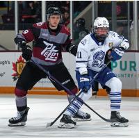 Peterborough Petes left wing Caden Taylor (left) vs. the Brampton Steelheads