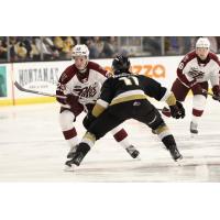 Peterborough Petes forward Braydon McCallum (left) vs. the Kingston Frontenacs
