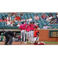 Pensacola Blue Wahoos welcome Dalvy Rosario (1) after his home run