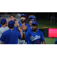 Tulsa Drillers exchange high fives after a comeback win