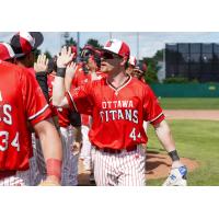 Ottawa Titans outfielder Nolan McCarthy exchanges high fives