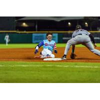 Montgomery Biscuits second baseman Cooper Kinney slides into third with a triple